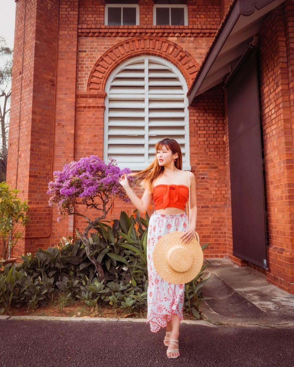 chervon khoo wearing crop top and long skirt at saint george's church singapore