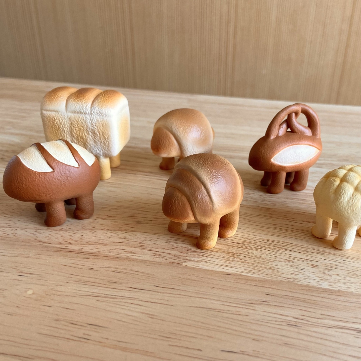 capsule toys of bread with legs by felt artist atelierhatena