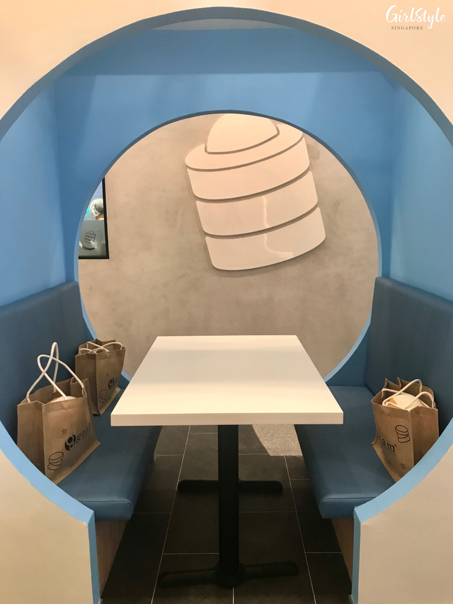 blue booth seating area at gram cafe vivocity