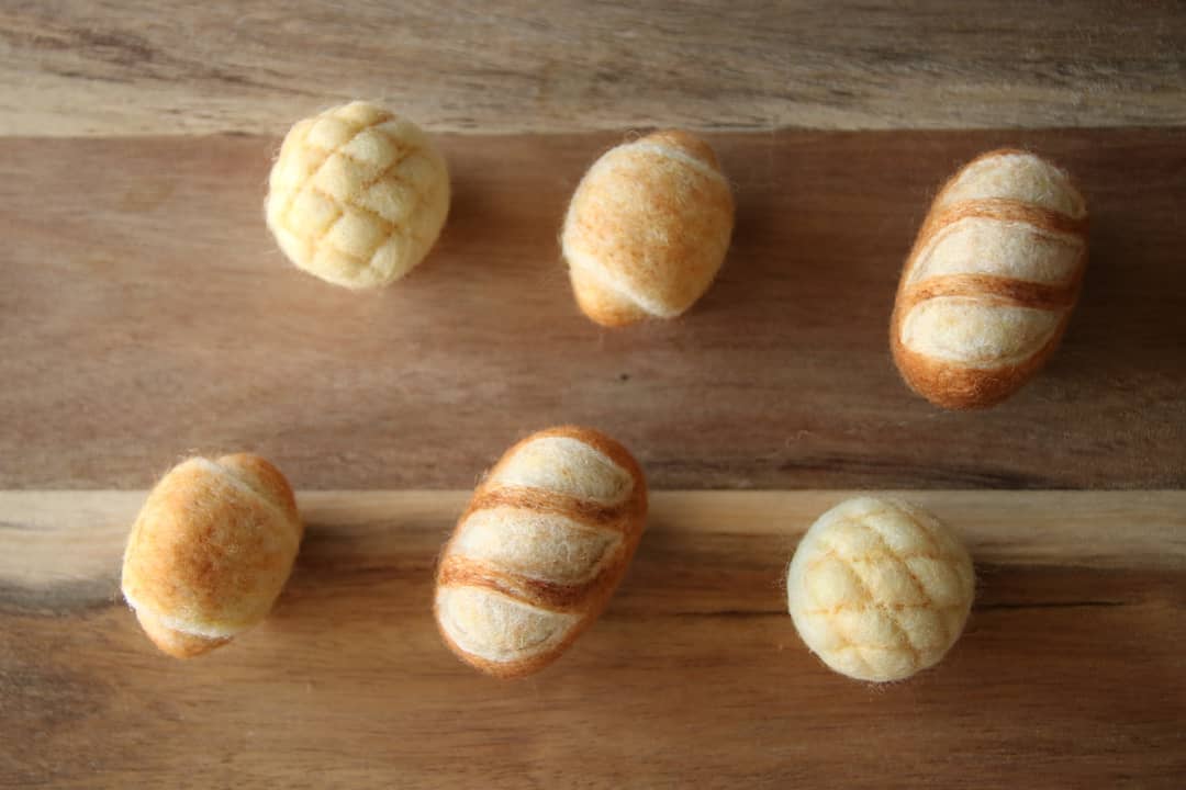top view of living bread animal wool felt figures by atelierhatena