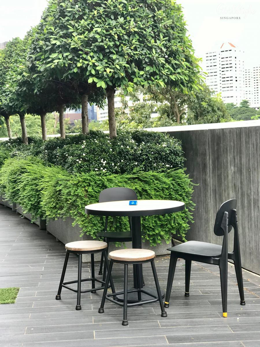 great world food junction food court outdoor rooftop seating area with greenery