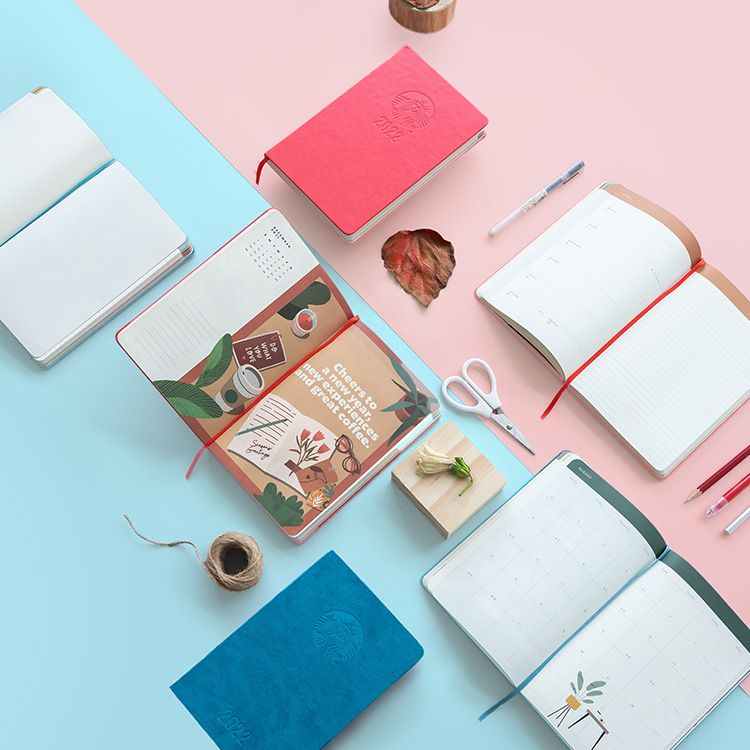 open pages of starbucks singapore Moleskine planner 2022 red and blue