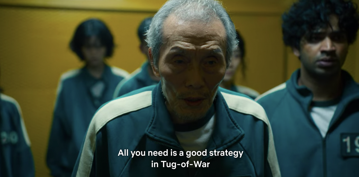 Player 001 telling his team that a good strategy is needed to win a game of tug of war
