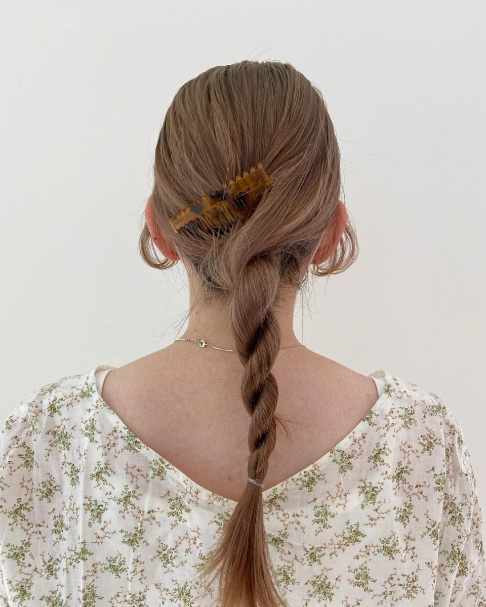 japanese low twisted braided ponytail hairstyle with comb