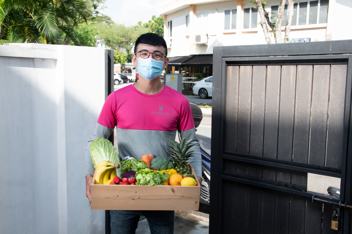 pandamart day 2021_foodpanda promo code_ groceries delivery person