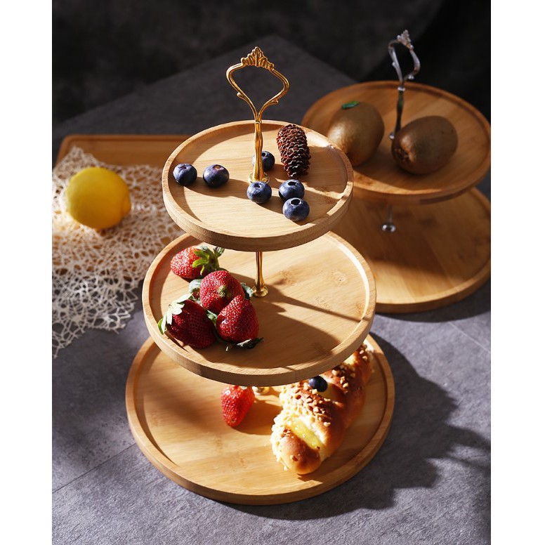 wooden and gold three tiered afternoon tea stand with pastry cakes singapore