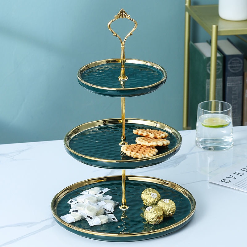 teal and gold three layer afternoon tea stand with pastry cakes singapore