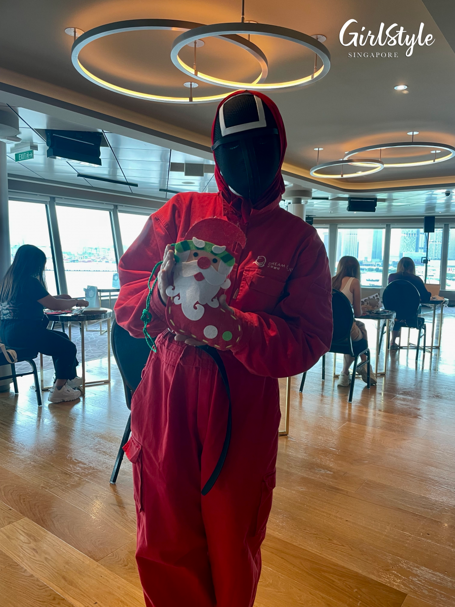Dream Cruises Nordic Christmas Adventure_Christmas workshop featuring staff dressed as masked workers from Squid Game