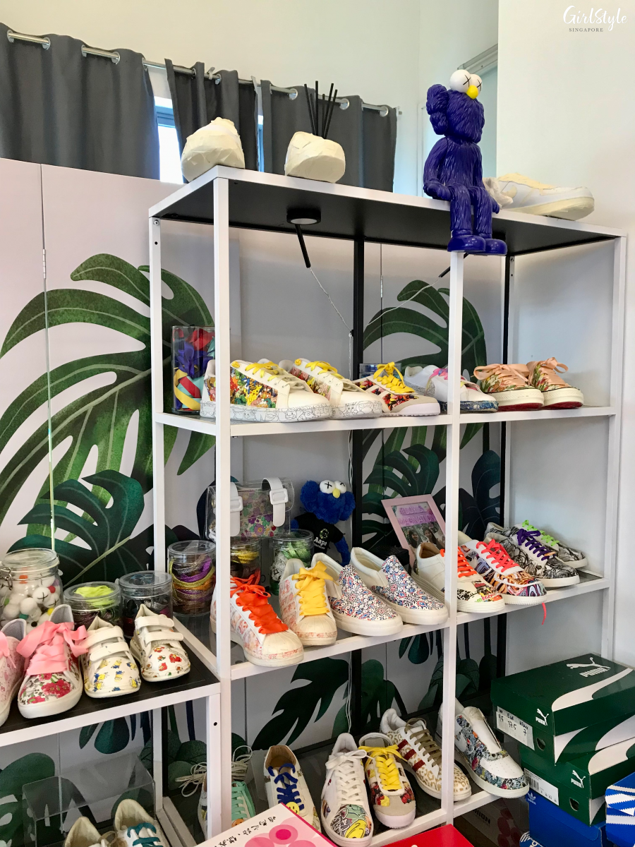 Shelf of shoes with customised designs at the hydro dipping workshop at Joy & Imagination