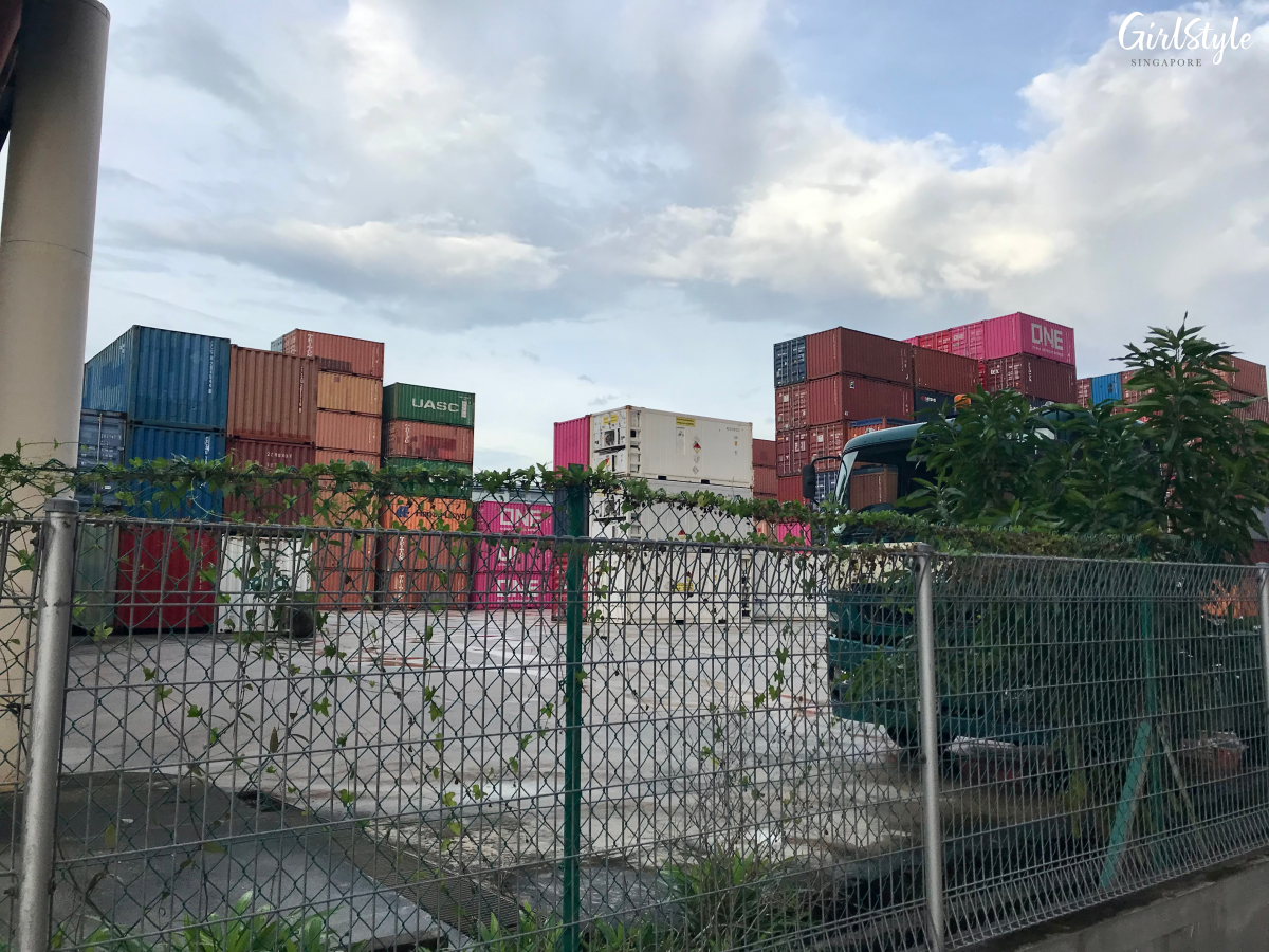 Shipping containers beside 中河小镇网红餐厅 tent hot pot restaurant in Singapore