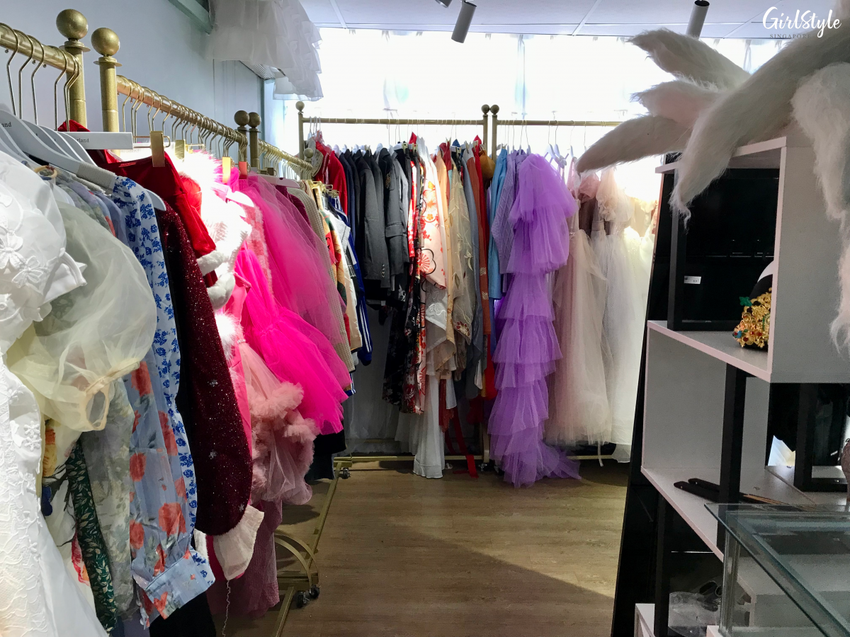 Racks of clothes in dressing room at I WAN Selfie Studio