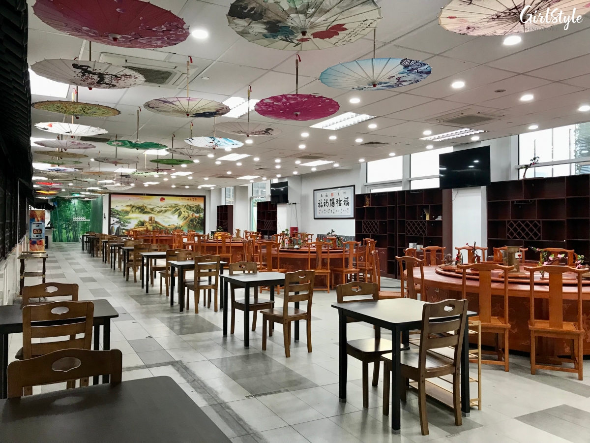 Indoor seating area at 中河小镇网红餐厅 tent hot pot restaurant in Singapore