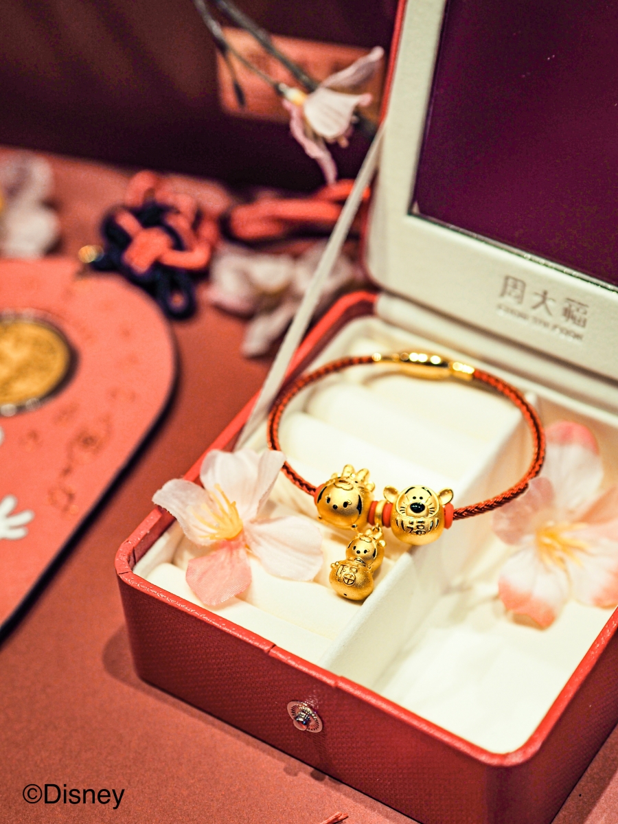 (From left) CHOW TAI FOOK “Disney Tsum Tsum Collection, “Minnie” Year of the Tiger Pure Gold Charm, $410, “Minnie” Year of the Tiger Pure Gold Charm, $450, “Good Fortune” Daruma “Tigger” Pure Gold Charm, $430.