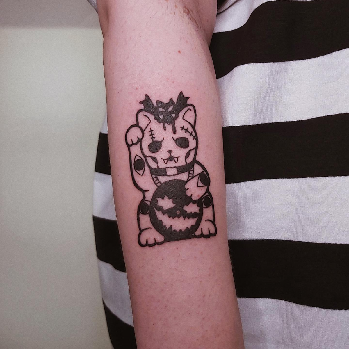 Cat tattoos in Singapore by Deck Ward