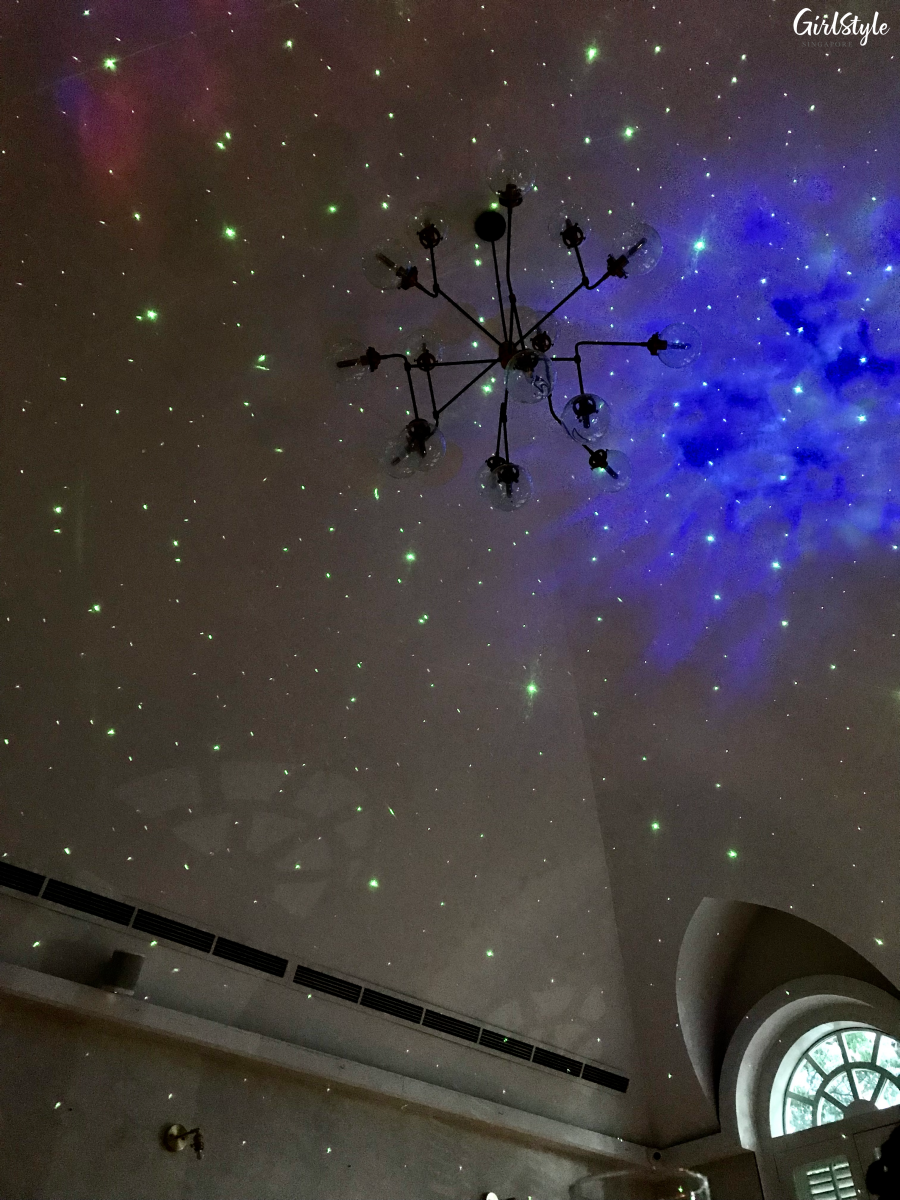 Ceiling with star projection lights at The Secret Patio Indoor Planetarium Campfire Night pop up dining