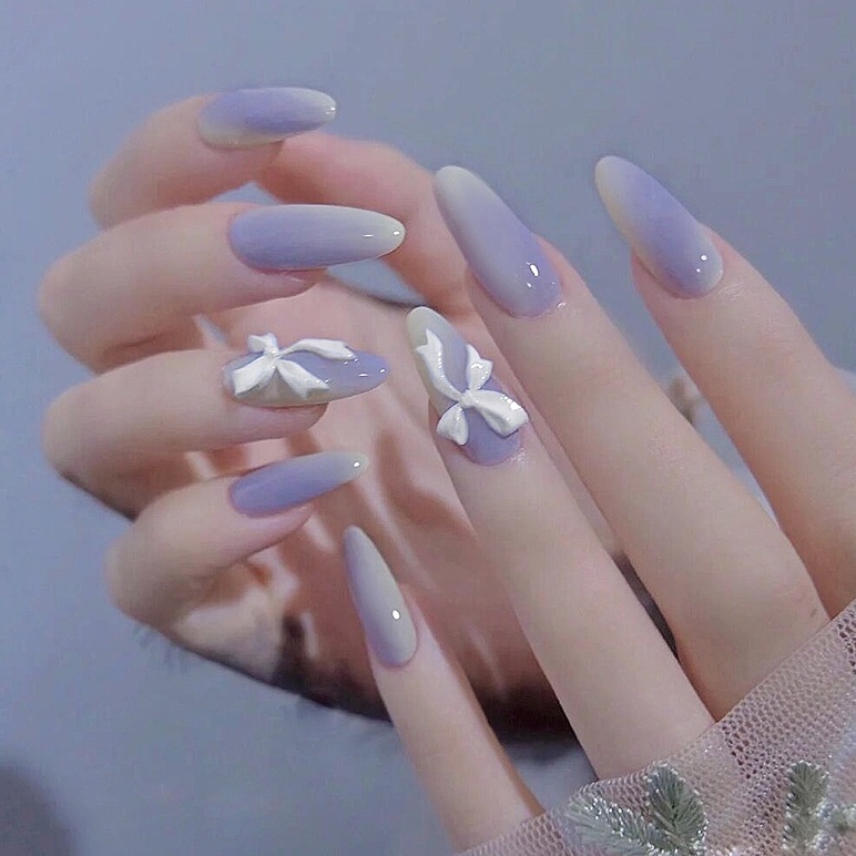 Lilac gradient nails with 3D bow charm