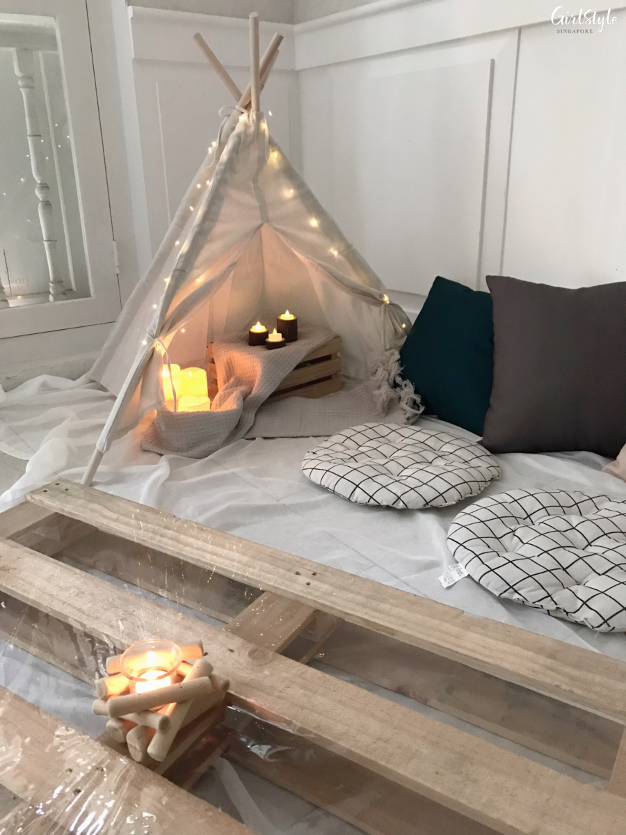 Tent and campfire photo area at The Secret Patio Indoor Planetarium Campfire Night pop up dining for Valentine's Day