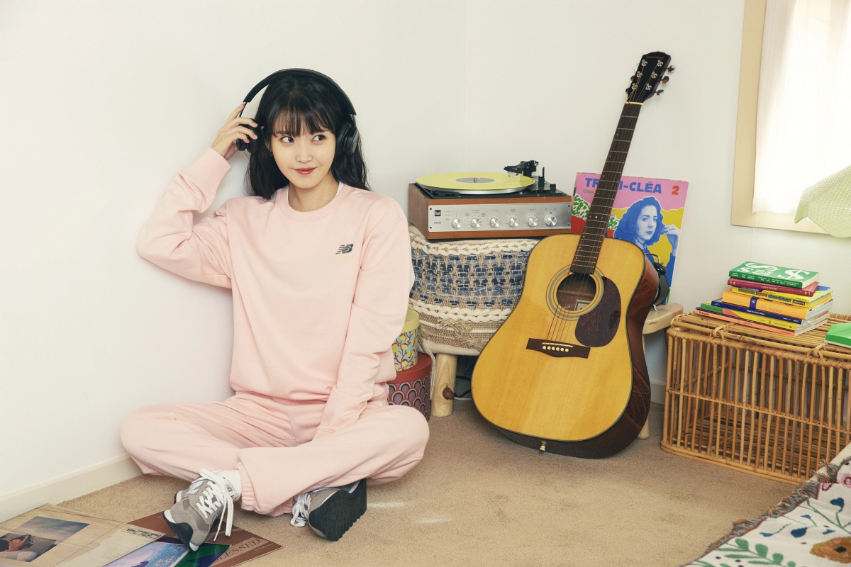 IU wearing New Balance Uni-ssentials sweater and sweatpants