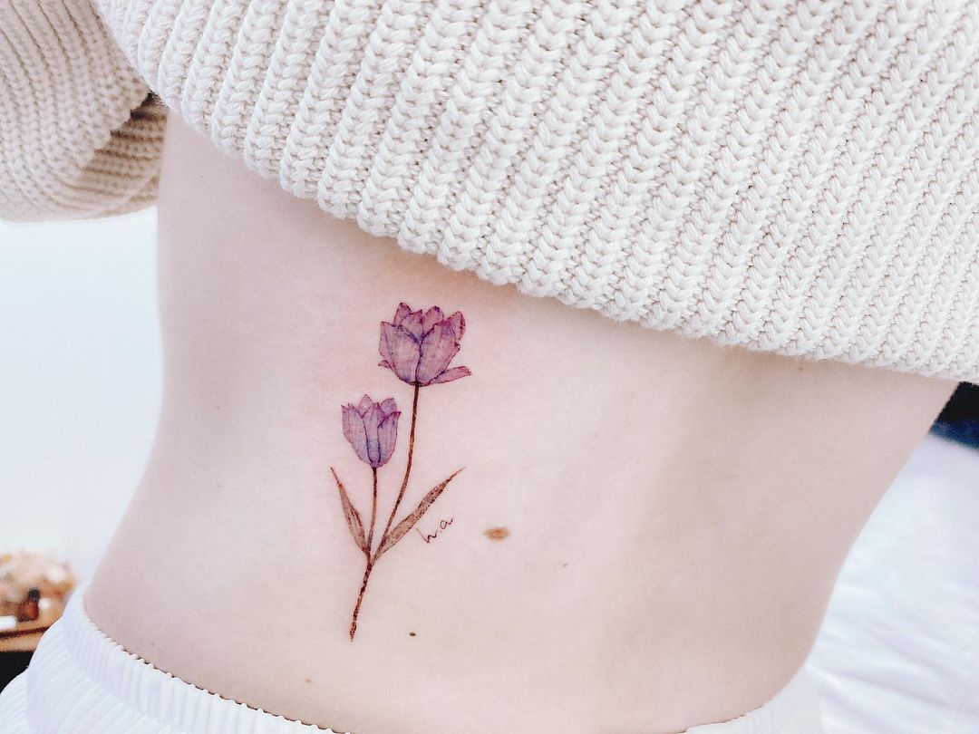 Fine line floral tattoo by Sylvia Tattoo in Singapore