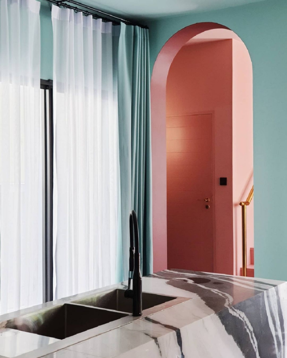 Mint green and marble kitchen with arched doorway in an Insta-worthy cafe-themed home in Bangkok, Thailand