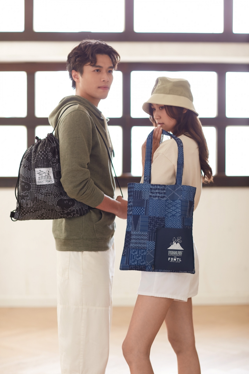 7-Eleven Peanuts FDMTL Snoopy on Bridge black drawstring bag and Fuji Snoopy roll-up tote bag