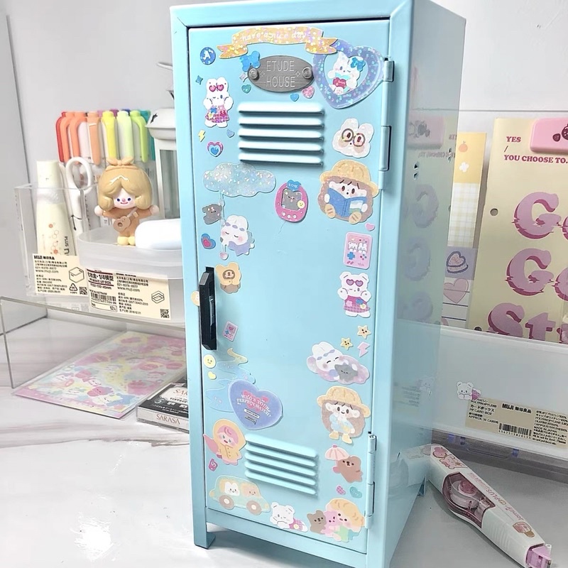 Mini locker storage stand covered in stickers