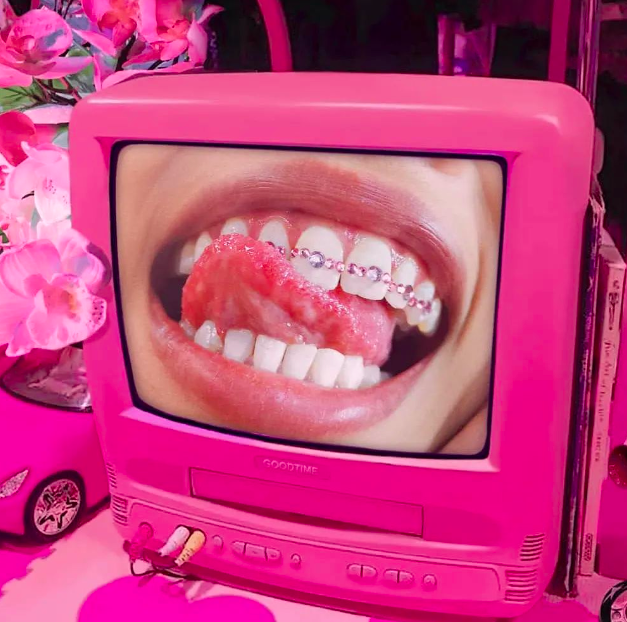 A row of pink and purple tooth gems