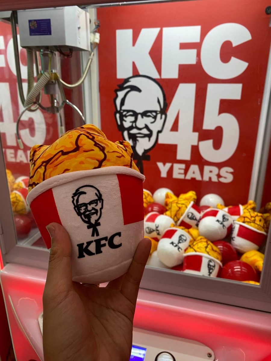 KFC fried chicken bucket plus toy from claw machine - KFC-themed #MEANDMYKFC installation at VivoCity