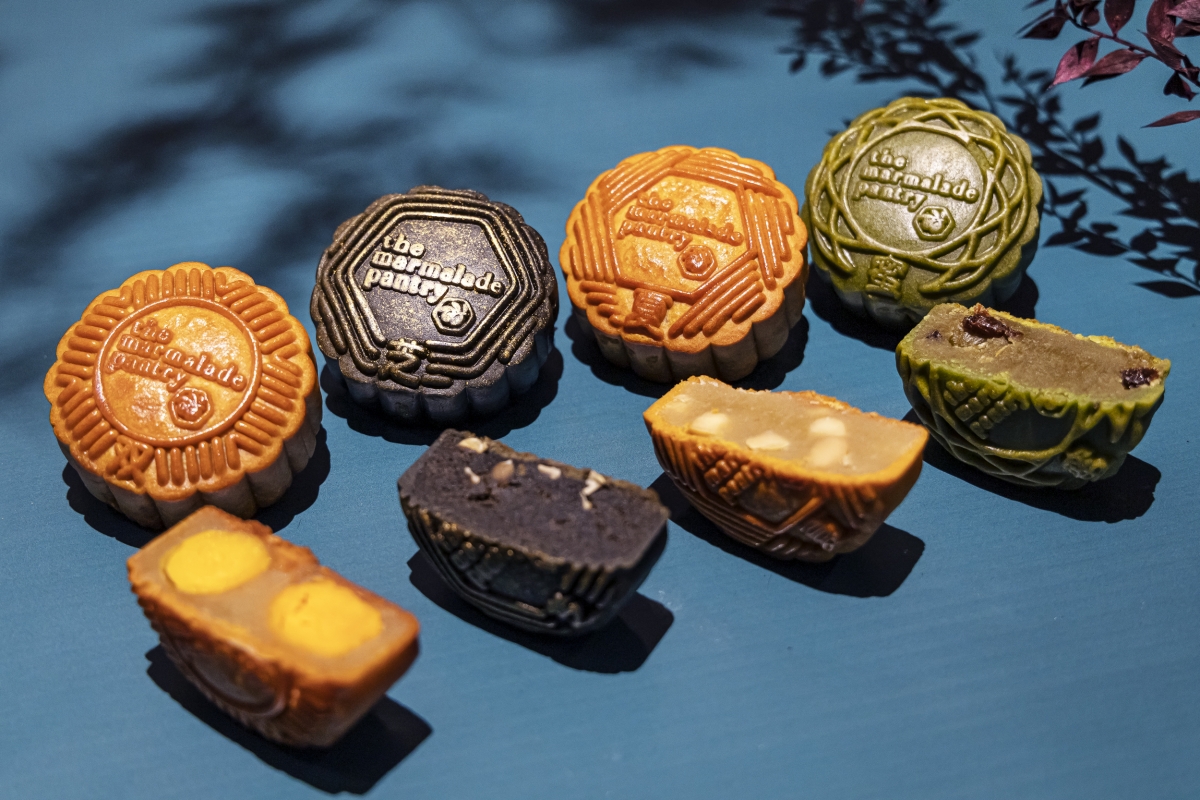 Flavours (from left): Double Yolk with White Lotus Paste, Baked Charcoal with Black Sesame and Melon Seeds, Traditional White Lotus Paste with Macadamia Nuts, Hojicha Matcha with Raisin.