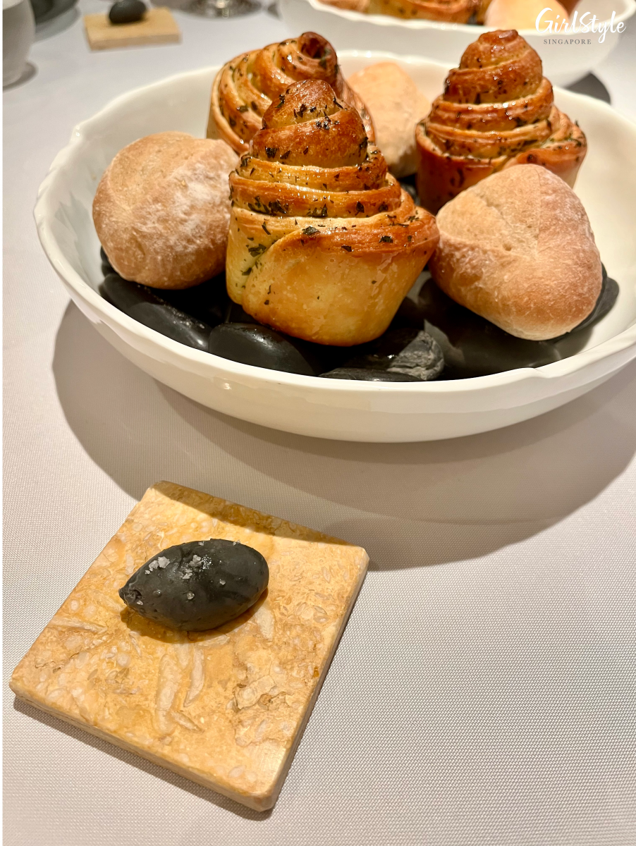 Beef tallow brioche and rye bread roll with caviar butter