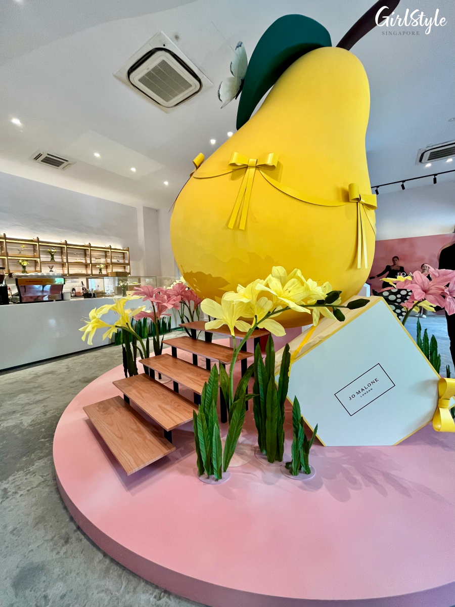 Installation of giant pear and flowers