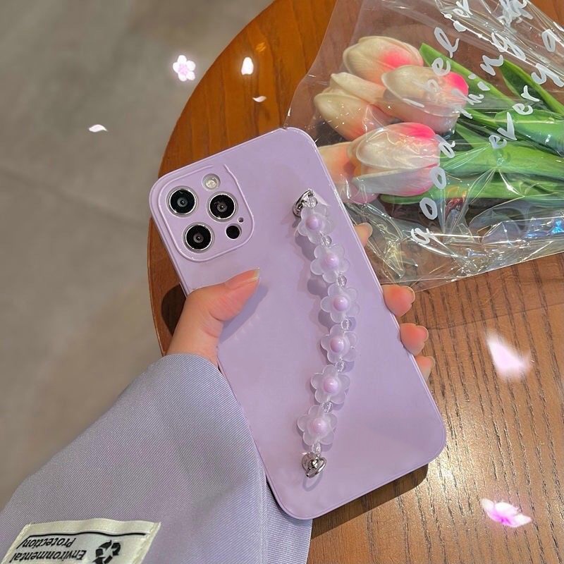 Lilac iPhone case with flower bracelet