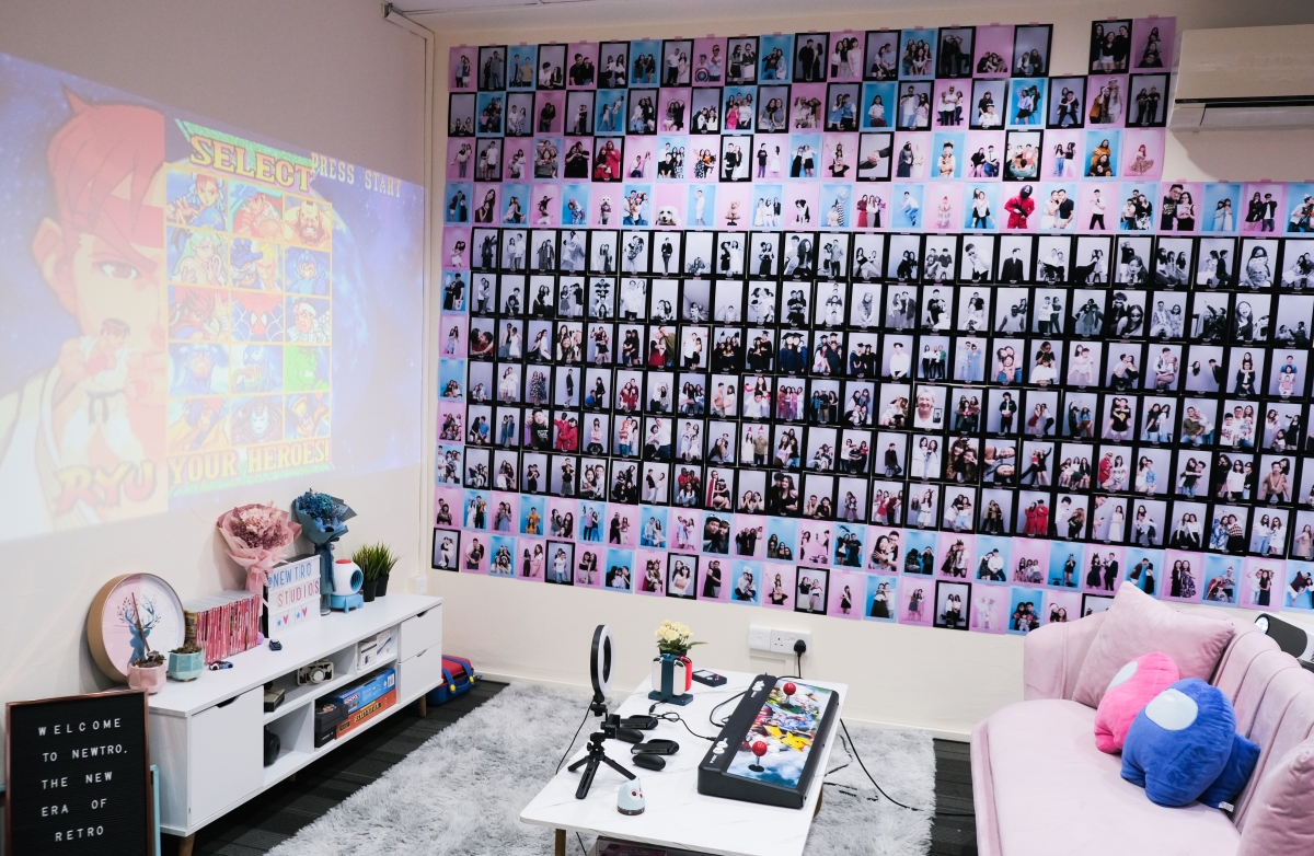 Lounge area with retro arcade games at Newtro Studios.