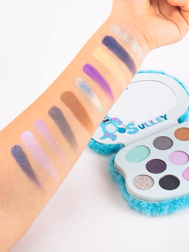 Arm swatches of INTO YOU x Pixar Monsters Inc Sulley eyeshadow palette