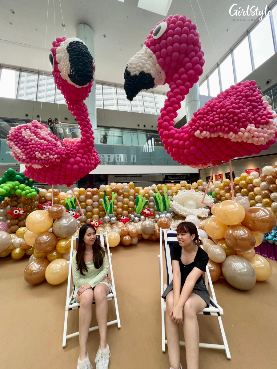 Deck chairs and flamingo balloon installation