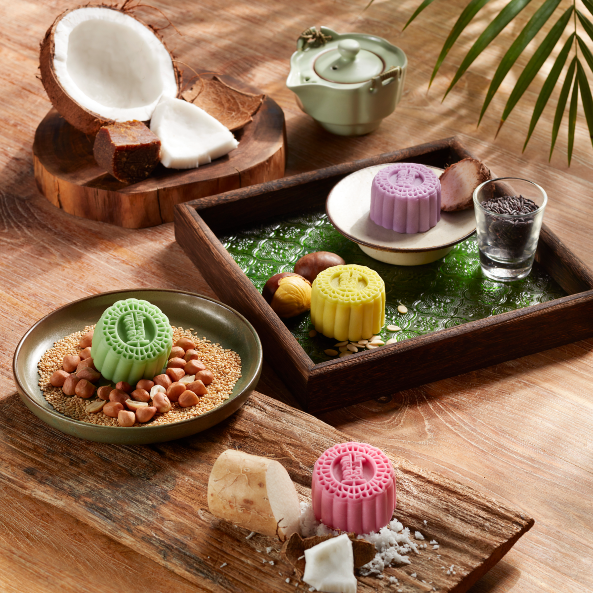 Asian Flavours Petite Snow Skin Mooncakes: Black Glutinous Rice Pulut Hitam, Roasted Chestnut, Gula Melaka with Chinese Yam & Coconut, and Macau Peanut Candy (clockwise from top)