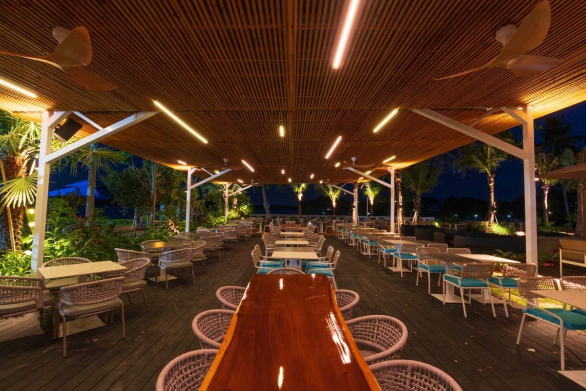 Alfresco dining area at night at Canopy Changi Village