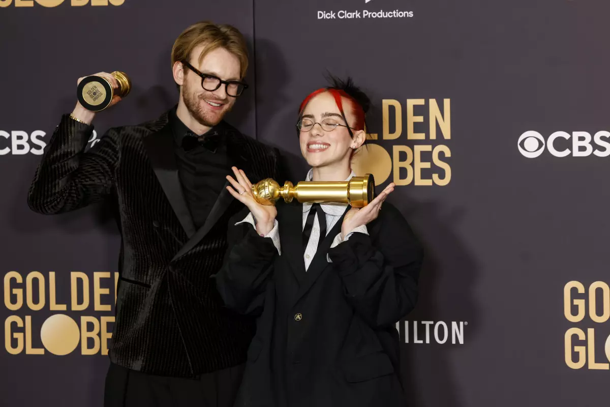 Finneas O’Connell and Billie Eilish pose with their Golden Globes for Original Song - Motion Picture "What Was I Made For"