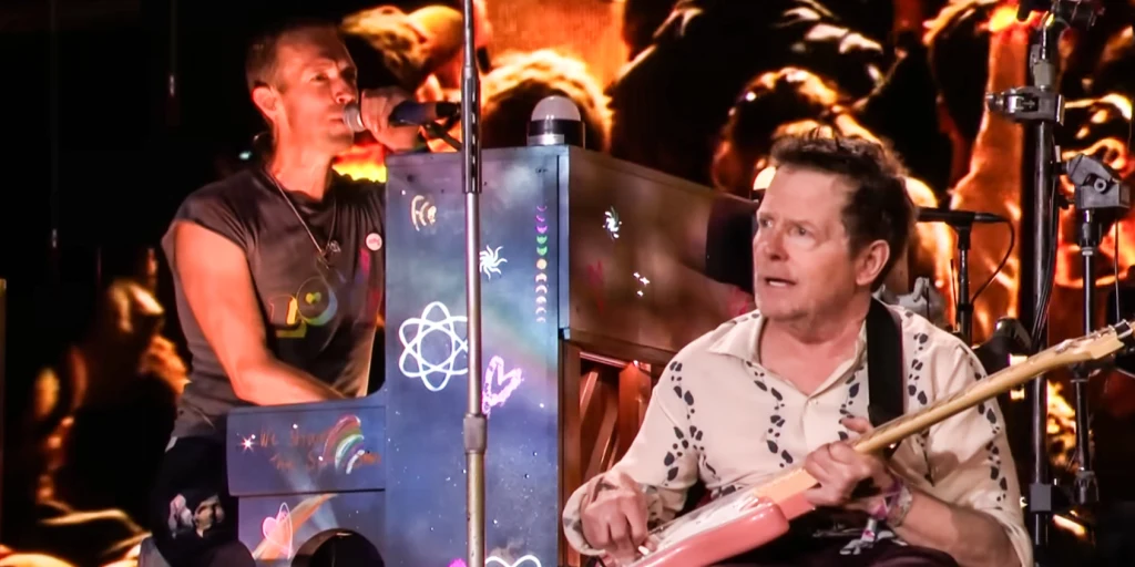 Coldplay's frontman Chris Martin with Michael J. Fox at the Glastonbury Festival on 29 June 2024