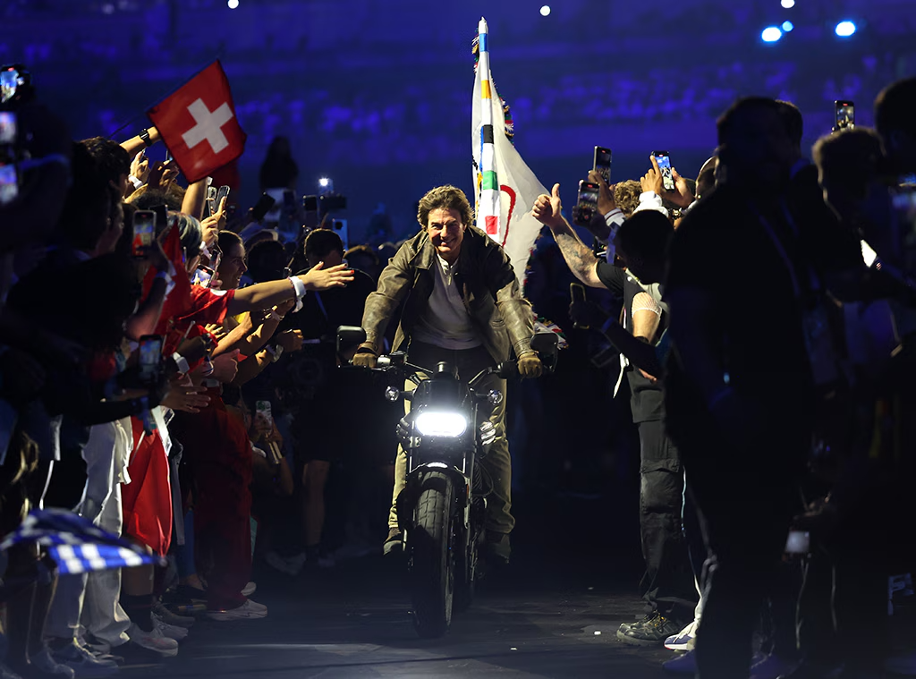 Tom Cruise rode out of the Paris 2024 Olympics on a motorcycle with the flag flying behind him