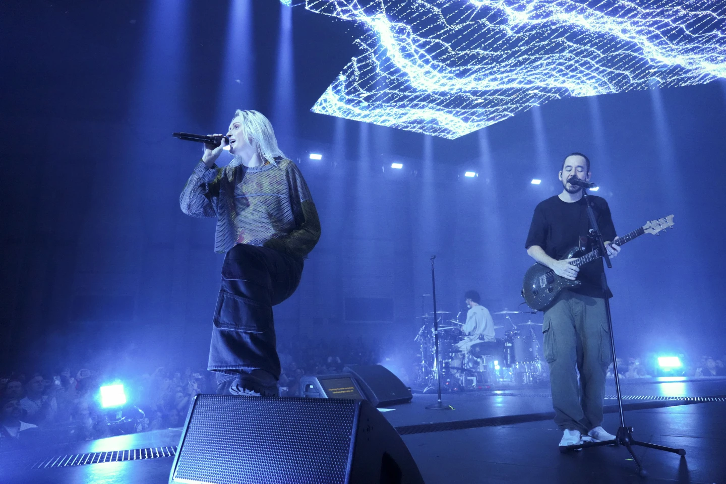 Emily Armstrong, Colin Brittain, and Mike Shinoda performing during the livestream event on 5 September 2024.