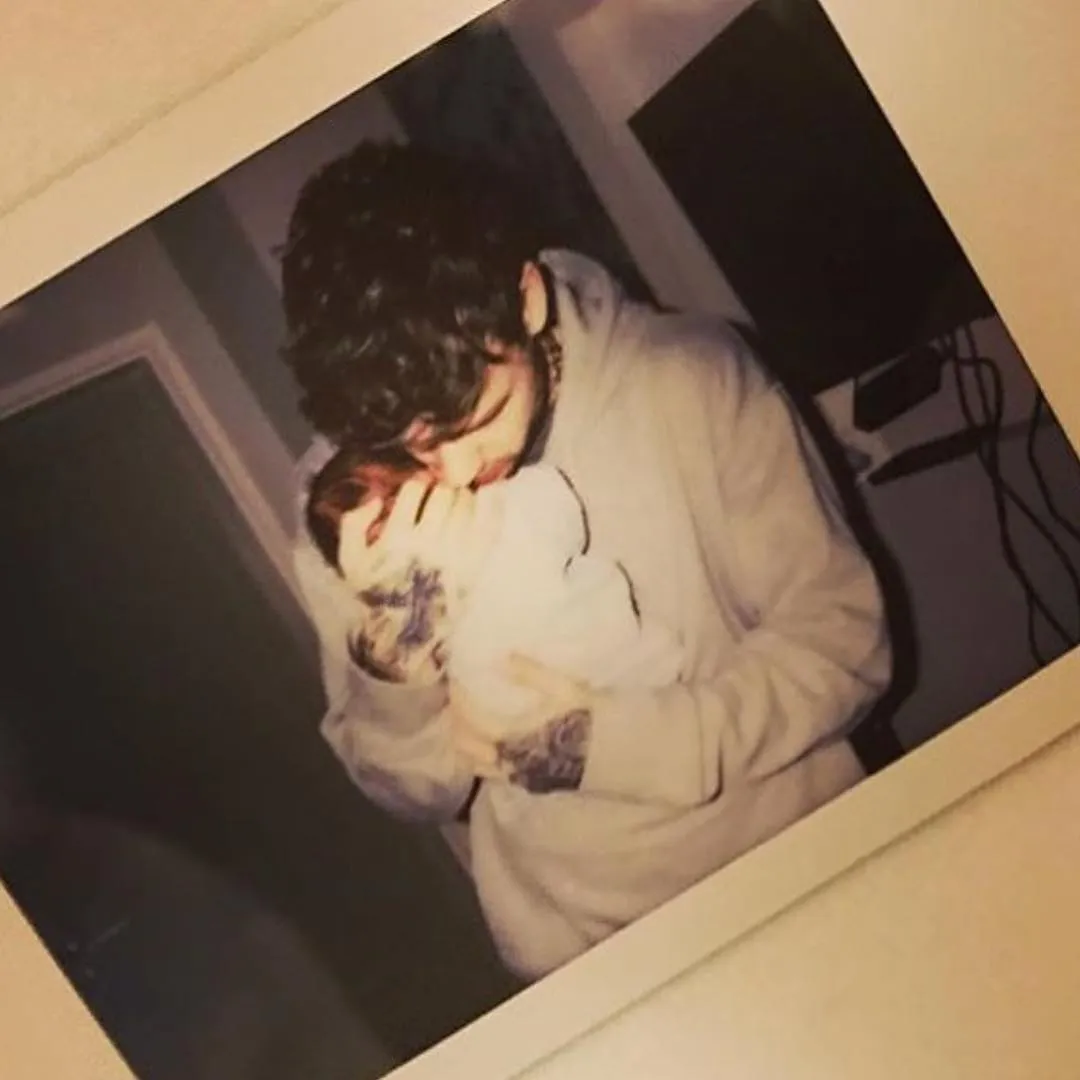 Liam Payne holds son Bear