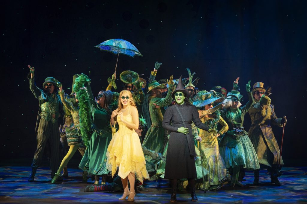 Courtney Monsma (Glinda), Sheridan Adams (Elphaba) and the Australian cast of WICKED, 2023 Sydney season