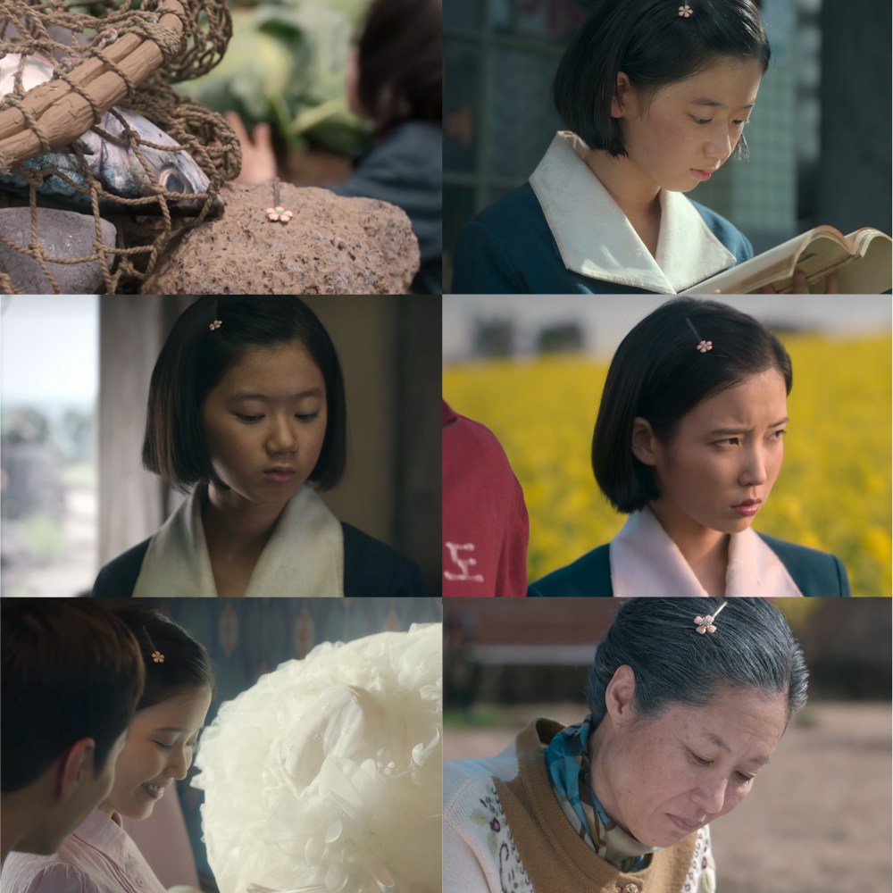 Ae-sun wearing the same flower hair pin gifted by Gwan-sik