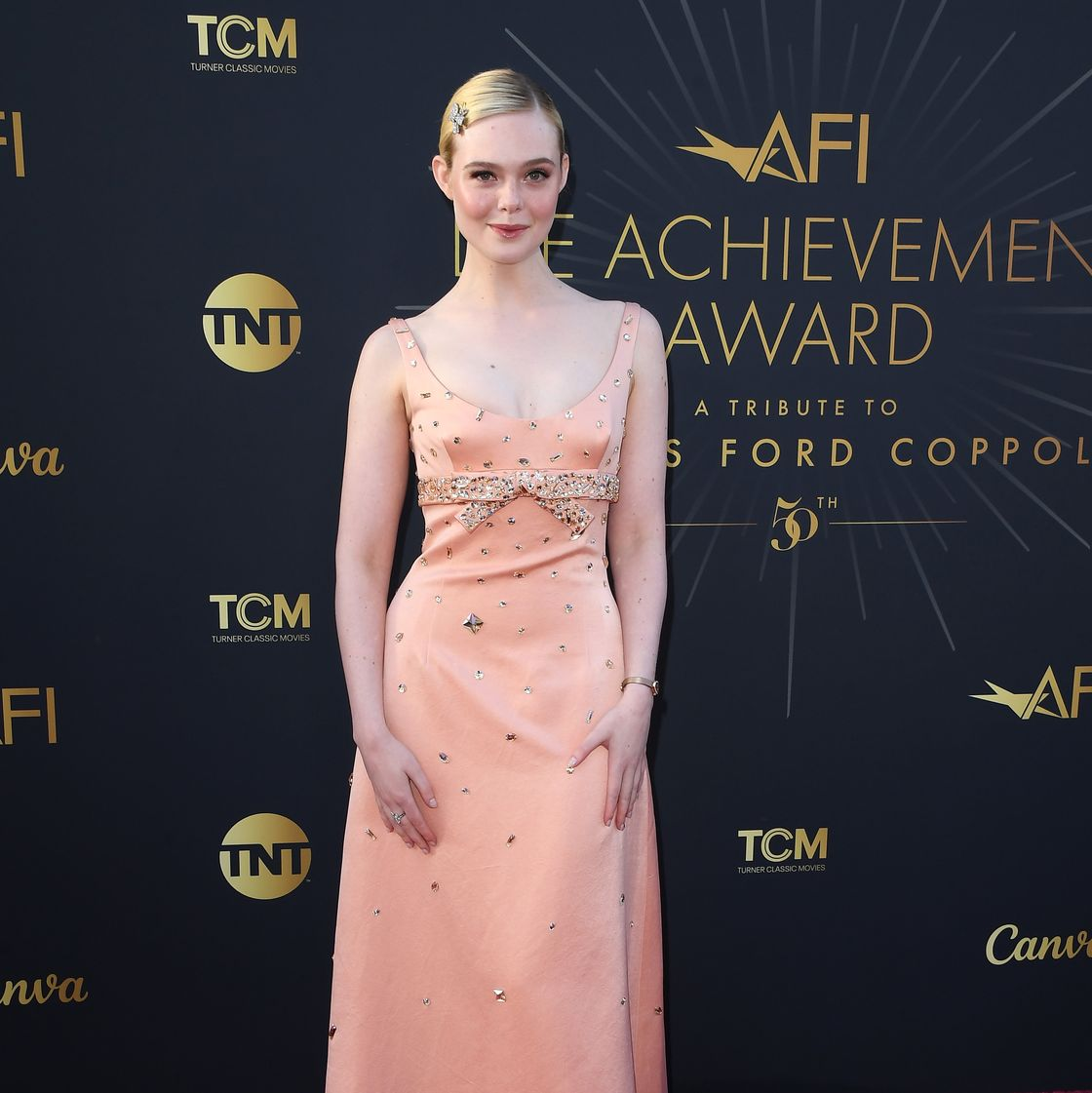 Elle Fanning as Effie Trinket
