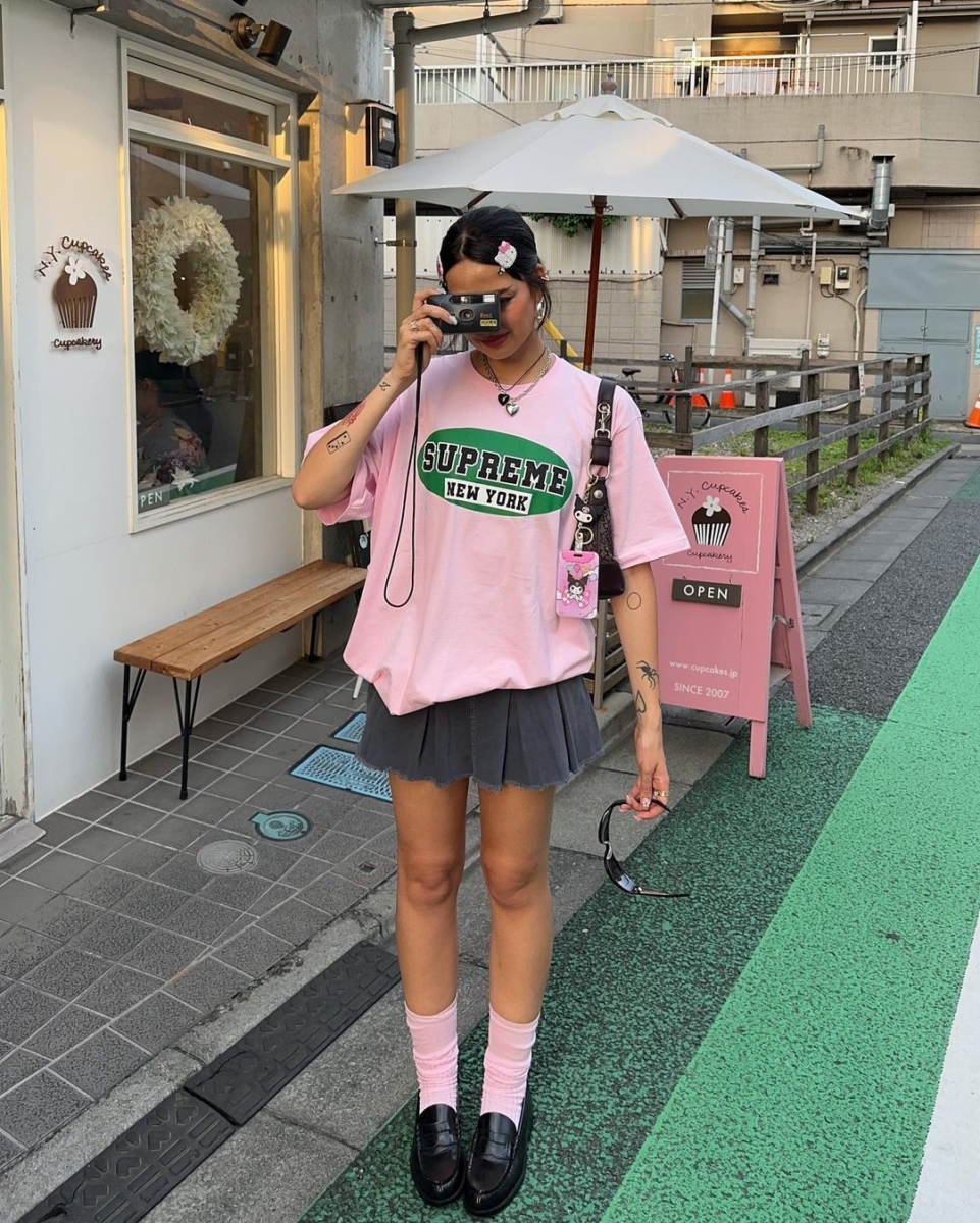 Oversized tee tucked in, long socks, and loafers make your tennis skirt look fun and preppy