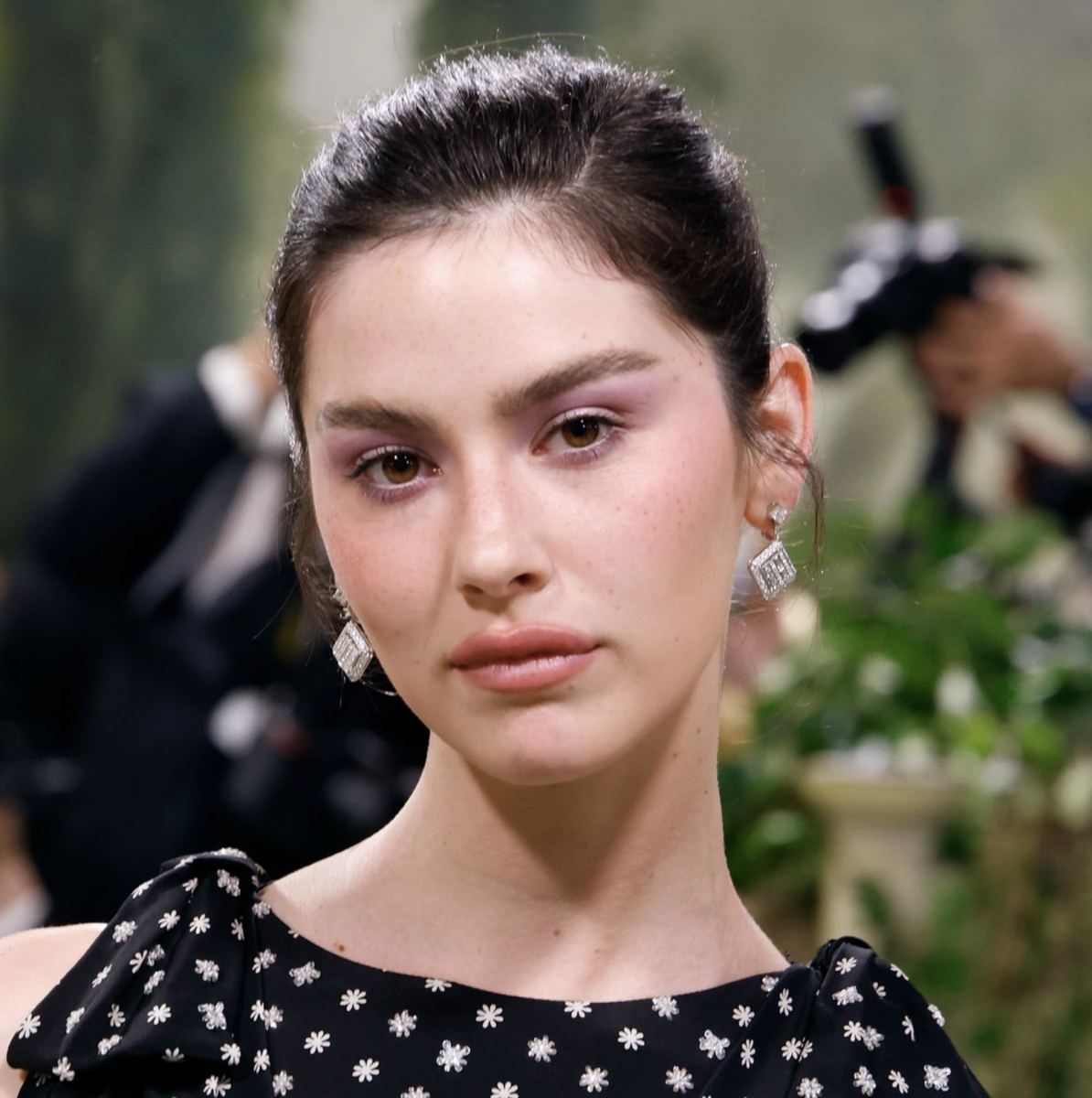 Gracie Abrams pairing purple eyeshadow with natural-looking lashes