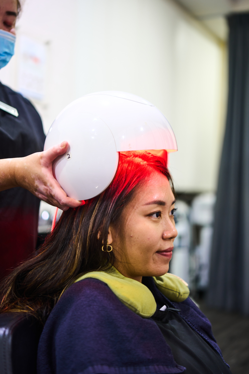 Vel putting on the Light Therapy Hair Bang